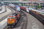 Stack train races east through the station